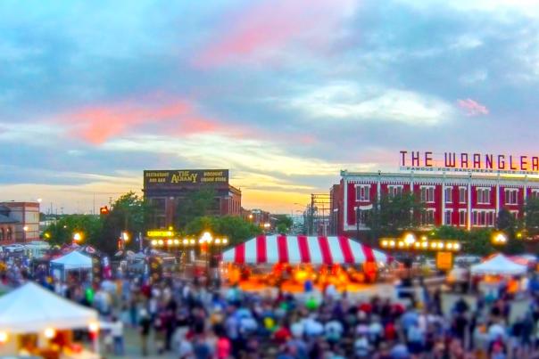 Cheyenne WY Events-The Cheyenne Depot Plaza at sunset with tents and people enjoying a festival