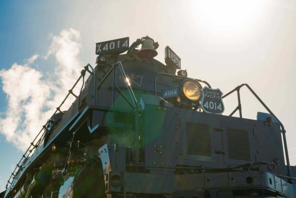 The worlds largest train, Union Pacific 4014 locomotive seen from the front with sunlight illuminating the details.