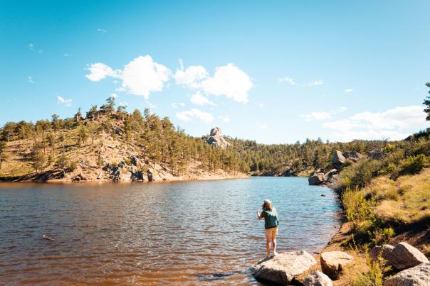 Panoramic lake view at sunset, ideal location featured in Wyoming fly fishing guides.