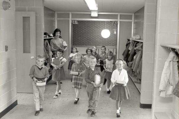 kids outside a classroom with a teacher