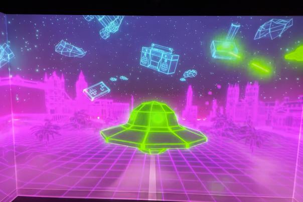 Image is of a spaceship projected on the wall at Immersive Gamebox.