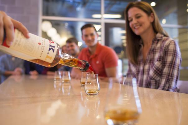Bourbon being poured at bar