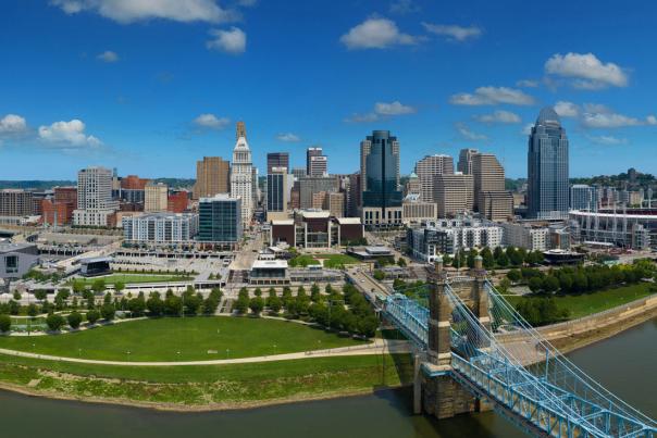 Image is an areial view of the City of Cincinnati from the Ohio River.