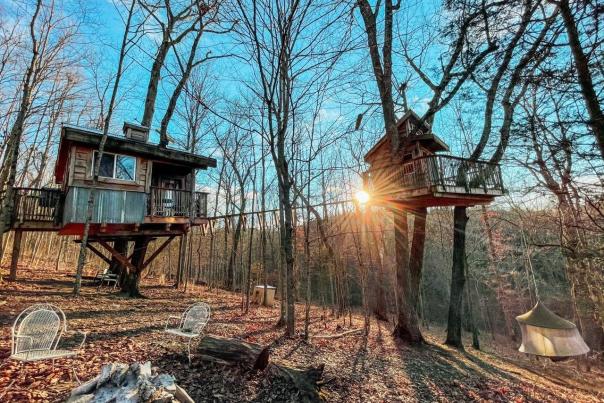 Two of the vacation treehouses at Earthjoy Treehouses in Kentucky