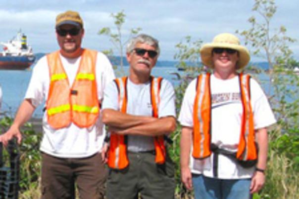 Volunteers in orange vests