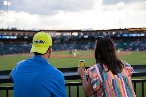 Couple looking out over a baseball field