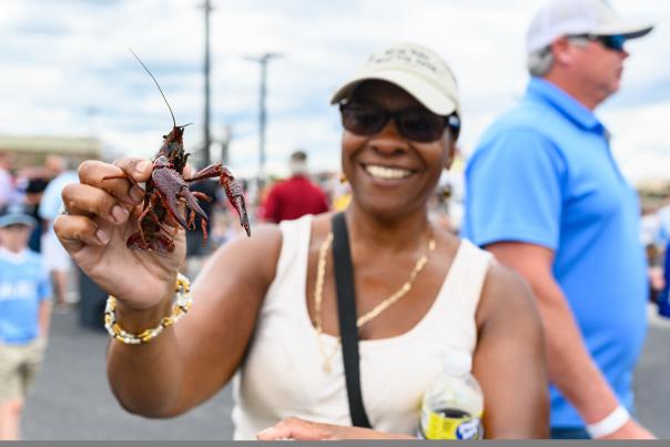 Woman holding a crawfish