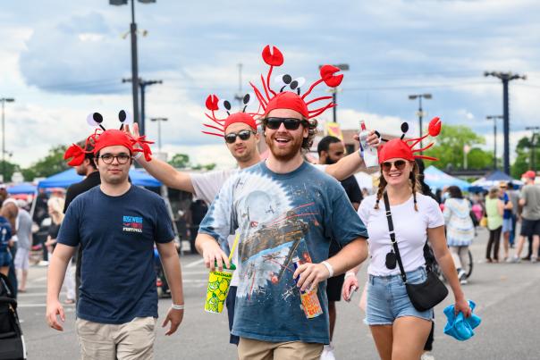 People wearing crawfish hats at a festival