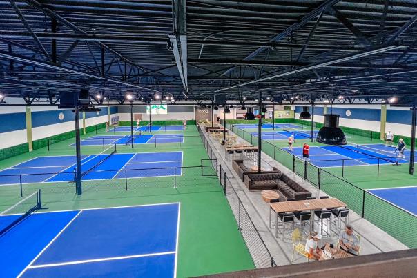 Interior of DiNK'd Pickleball facility showing courts