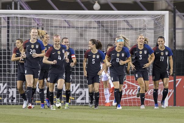 The U.S. Soccer Women's National Team runs on the field at MAPFRE Stadium.