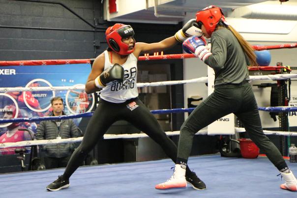 Boxer Morelle McCane throws a punch in the ring at a USOPC camp.