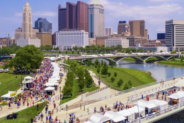 Crowd and booths along the riverfront at the Columbus Arts Festival