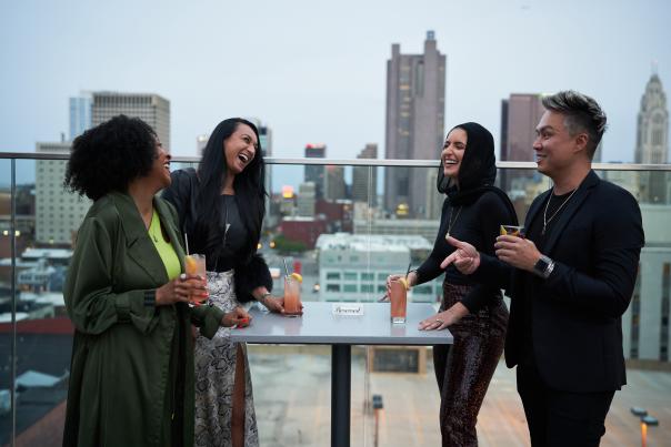 Group of diverse friends having cocktails at Goodale Station
