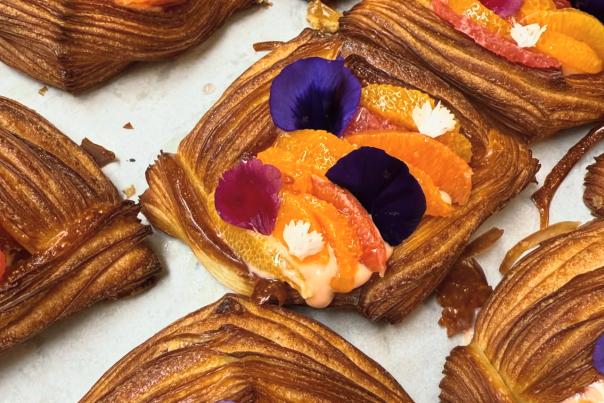 Beautiful pastries with fresh fruit and edible flowers