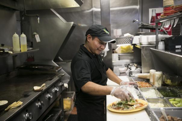 Man Cooking In Los Guachos Mexican Restaurant
