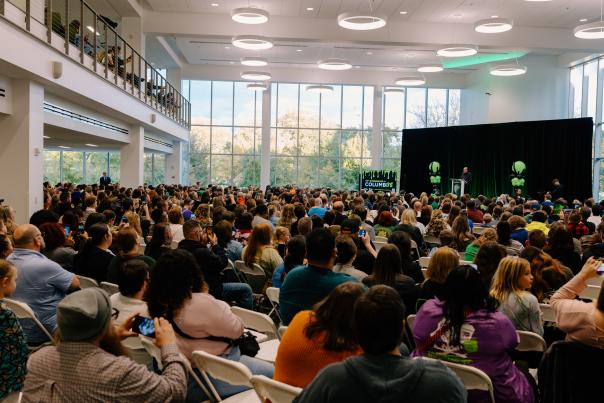A crowd of people sit in the Main Library listening to author R.L. Stine speak.