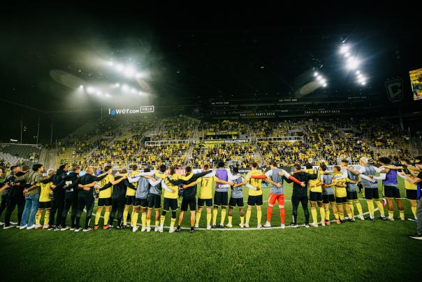 Crew Players Sing with Crowd