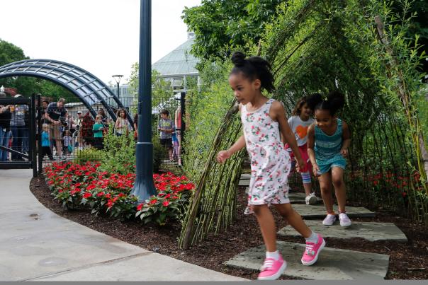 Kids play in the Children's Garden at the Franklin Park Conservatory & Botanical Gardens in Columbus.
