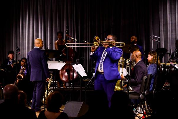 Band with trombone player in the focus