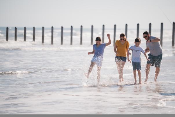 A family of 4 at the beach.