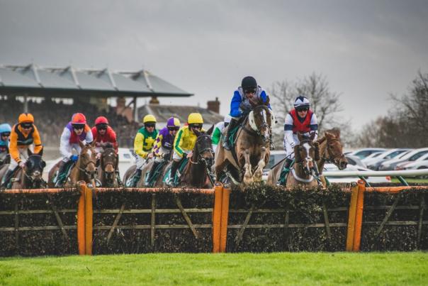 Jockeys racing horses at Warwick Racecourse
