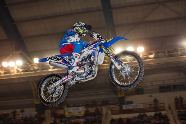 Person on a dirt bike making a jump at Motorama