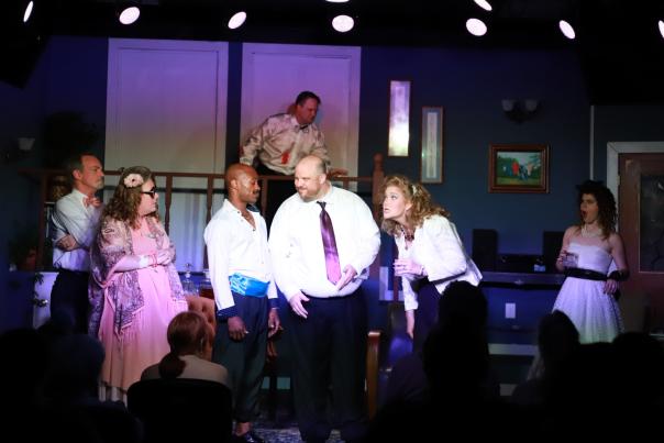 Cast of a play in the middle of a funny scene