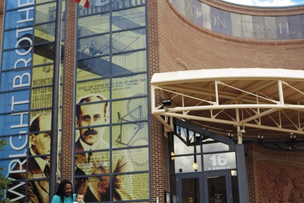 Child Pretending to Fly in front of Dayton Aviation Heritage National Historical Park
