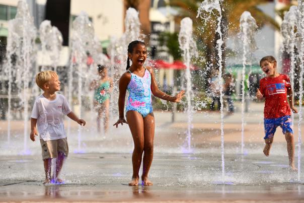 Children jump and play at ONE DAYTONA'S splash pad