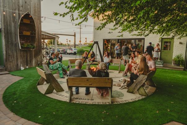 A group of guests at Dogfish Inn sitting around a fire.