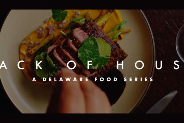 A graphic reading, "Back of House: A Delaware Food Series" with a photo of a steak being cut in the background.
