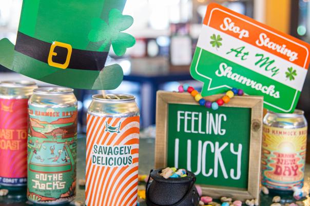St. Patrick's Day-themed items on a table at Crooked Hammock Brewery, including drinks.