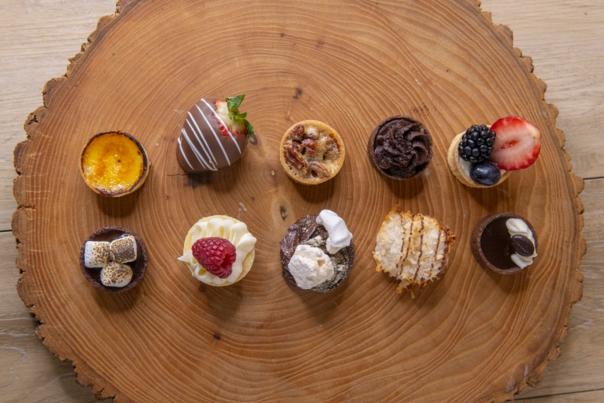Two rows of desserts, from an aerial view, by Desserts by Dana.