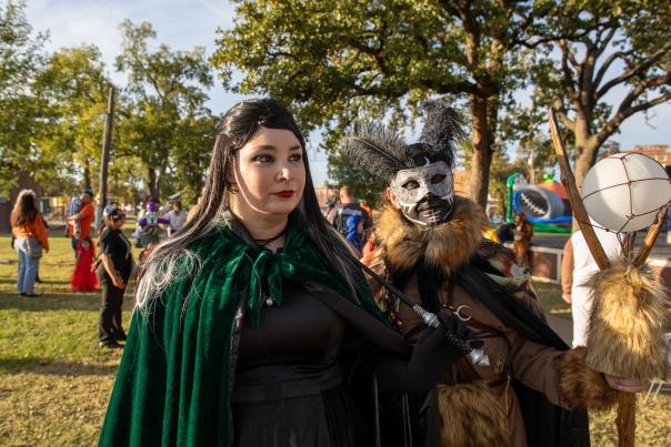 Adults dressed up in monster costumes for Halloween event Monsters on Main.