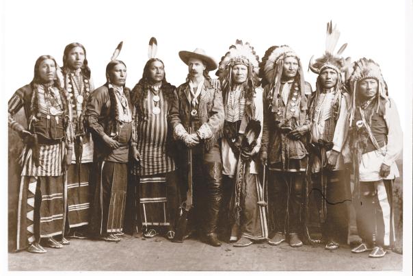 Historic photo of Buffalo Bill Cody and a group of Native Americans.