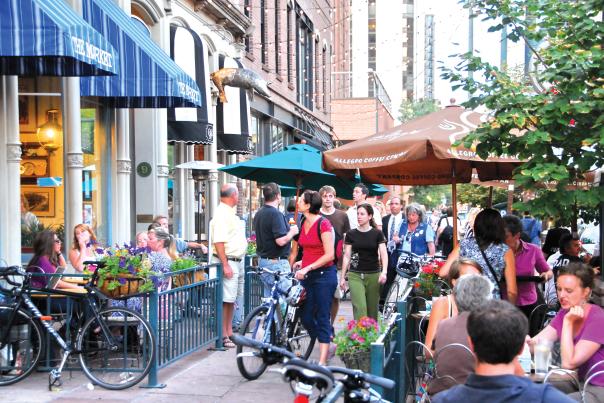 Shops and outdoor cafes entice on a sunny summer afternoon.