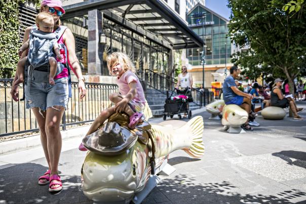 The "Howdy Trouty" cutthroat trout sculpture, representing the state fish, welcomes visitors to take a break and some photos on Denver's 16th Street.