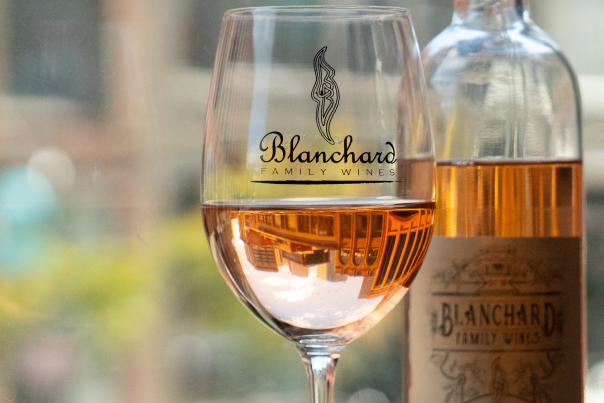 A glass and bottle of Blanchard Family Wines' rose.