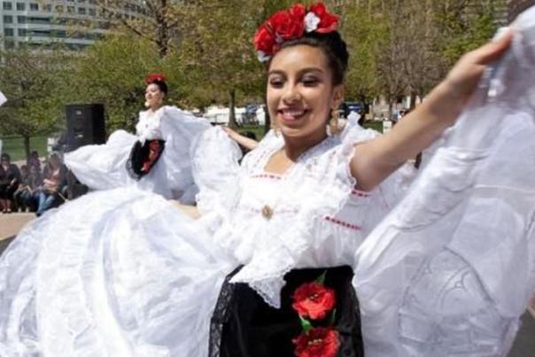 A dancer twirling in a dress during the Cinco de Mayo Festival in Denver, Colorado.