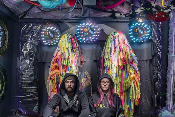 Two artists in a Spectra Art Space gallery in Denver, Colorado