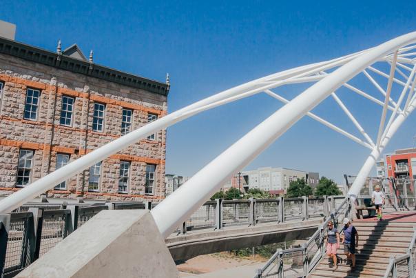 Pedestrians walk down the steps from the Highland Bridge in Denver, Colorado.