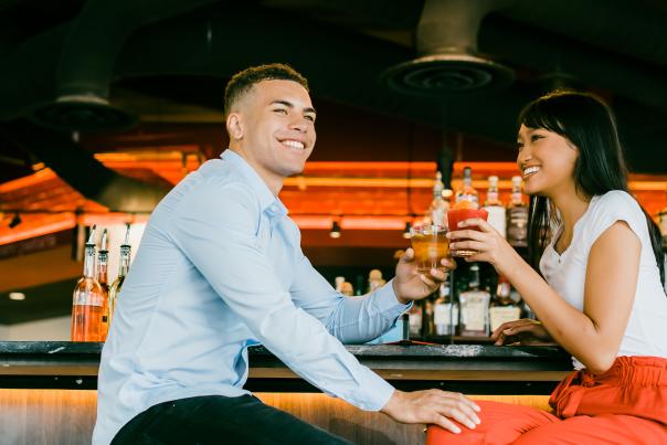 A couple drinks at a bar at Denver Milk Market.