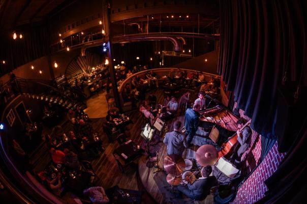 A band plays in moody lighting at Nocturne Jazz Club