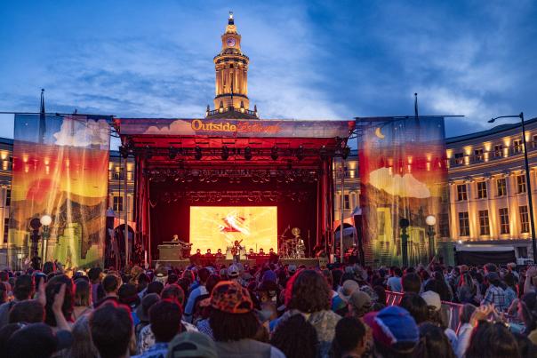 A crowd attends a concert at the Outside Festival in Civic Center Park in Denver, Colorado.