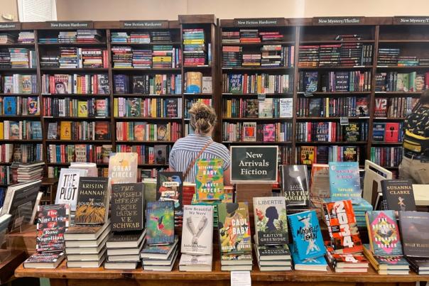 A person browses the shelves at Tattered Cover Bookstore