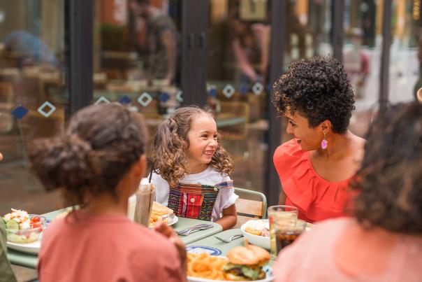 A family dines at a restaurant in McGregor Square in Denver, Colorado.