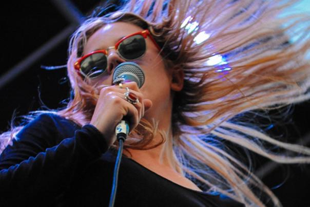 Woman singing at Denver's Underground Music Showcase