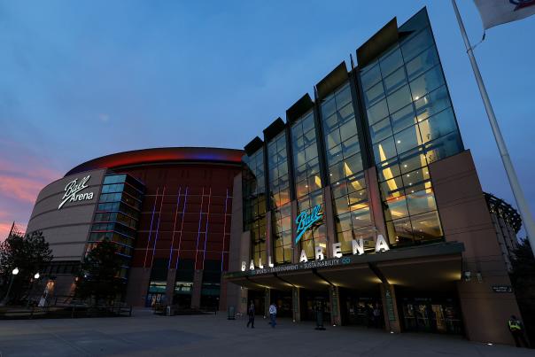 Ball arena glows at sunset in Denver, Colorado
