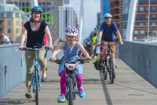 biking-family-downtown-bridge