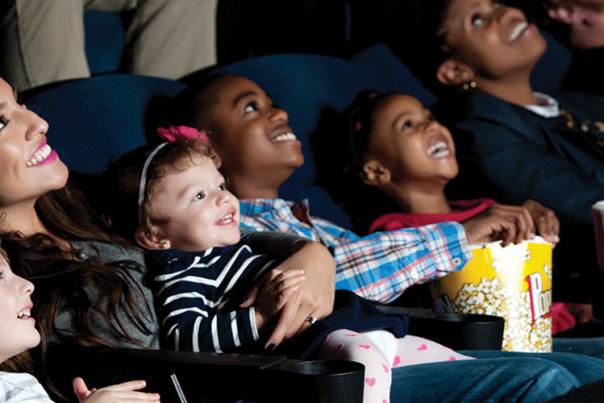 Family With Children Watching In Theater
